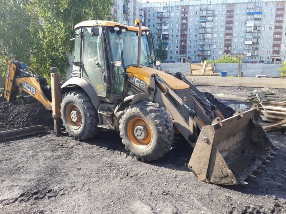 Услуги спецтехники для разравнивания грунта и насыпи стоимость услуг и где заказать - Кемерово